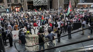 A large group of protesters in the street. 