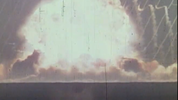 An old photograph of a large nuclear explosion.