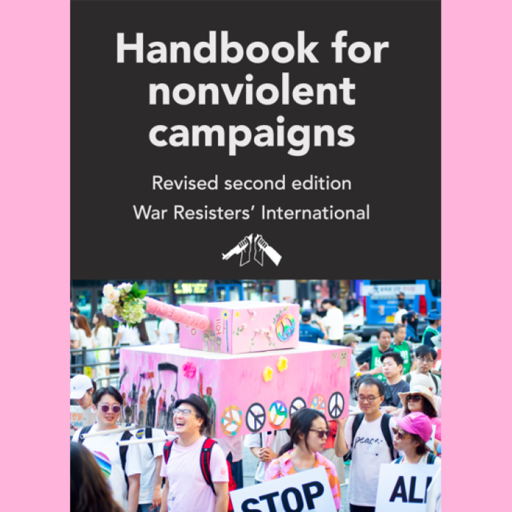 The cover of the handbook, featuring an image of a crowd of people carrying a cardboard pink "tank" decorated with peace symbols